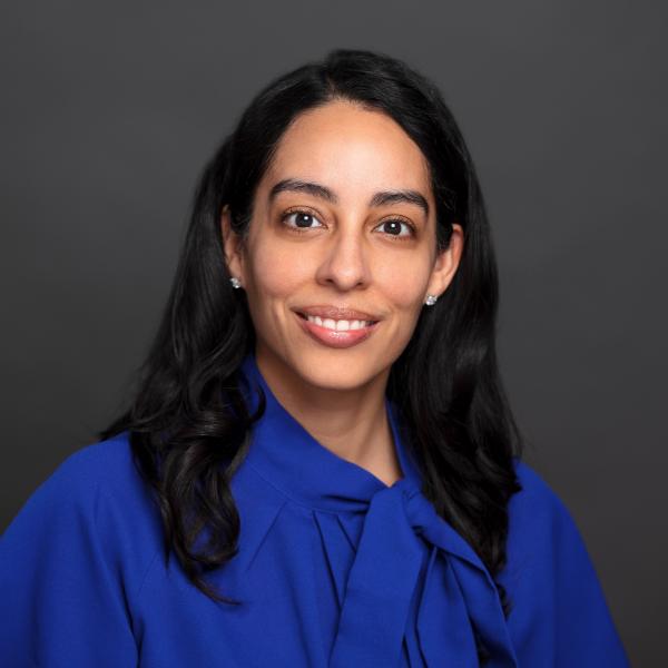 Woman with black hair in blue blouse